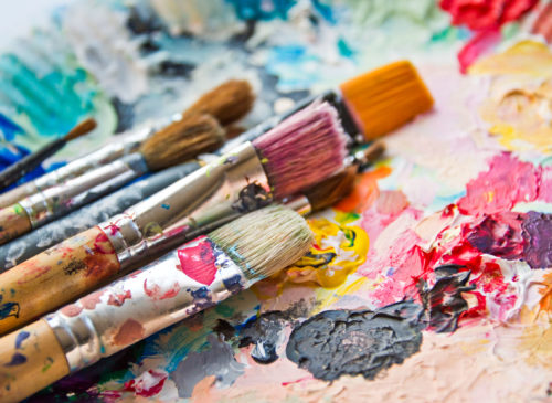 44555282 - used paint brushes on a colorful painter palette 44555282 - used paint brushes on a colorful painter palette
