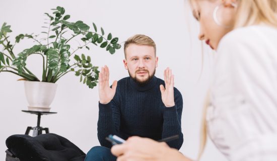 sad-young-man-discussing-her-problems-with-female-psychologist-clinic sad-young-man-discussing-her-problems-with-female-psychologist-clinic